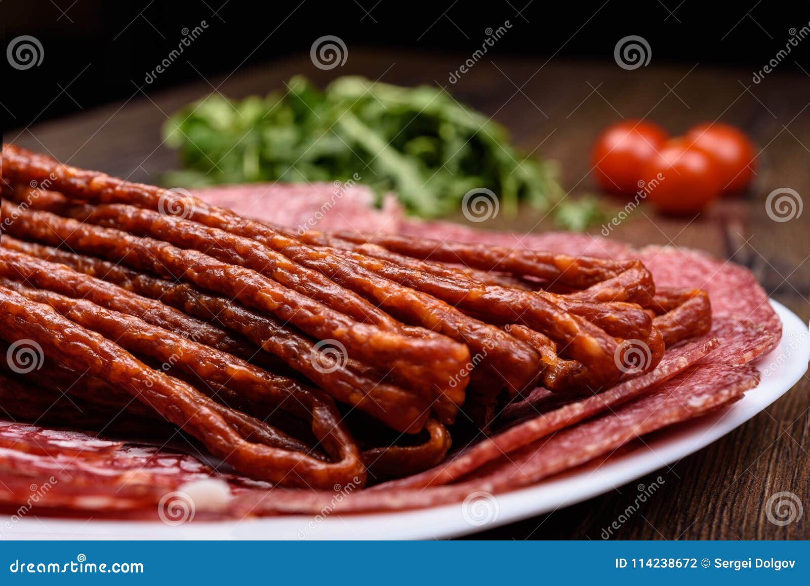 macro photo a plate with various sausage varieties.