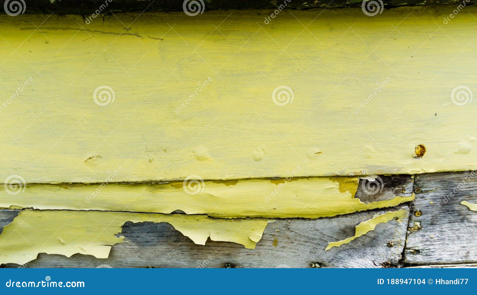 closeup of yellow painted plank of a boats hull