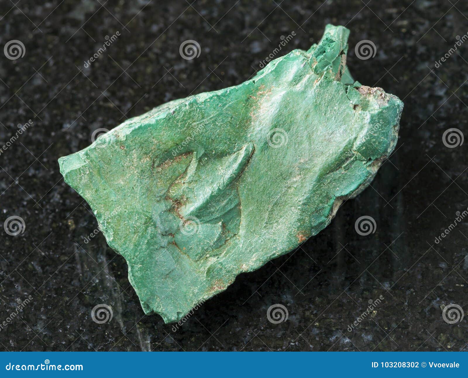 rough volkonskoite stone on dark background