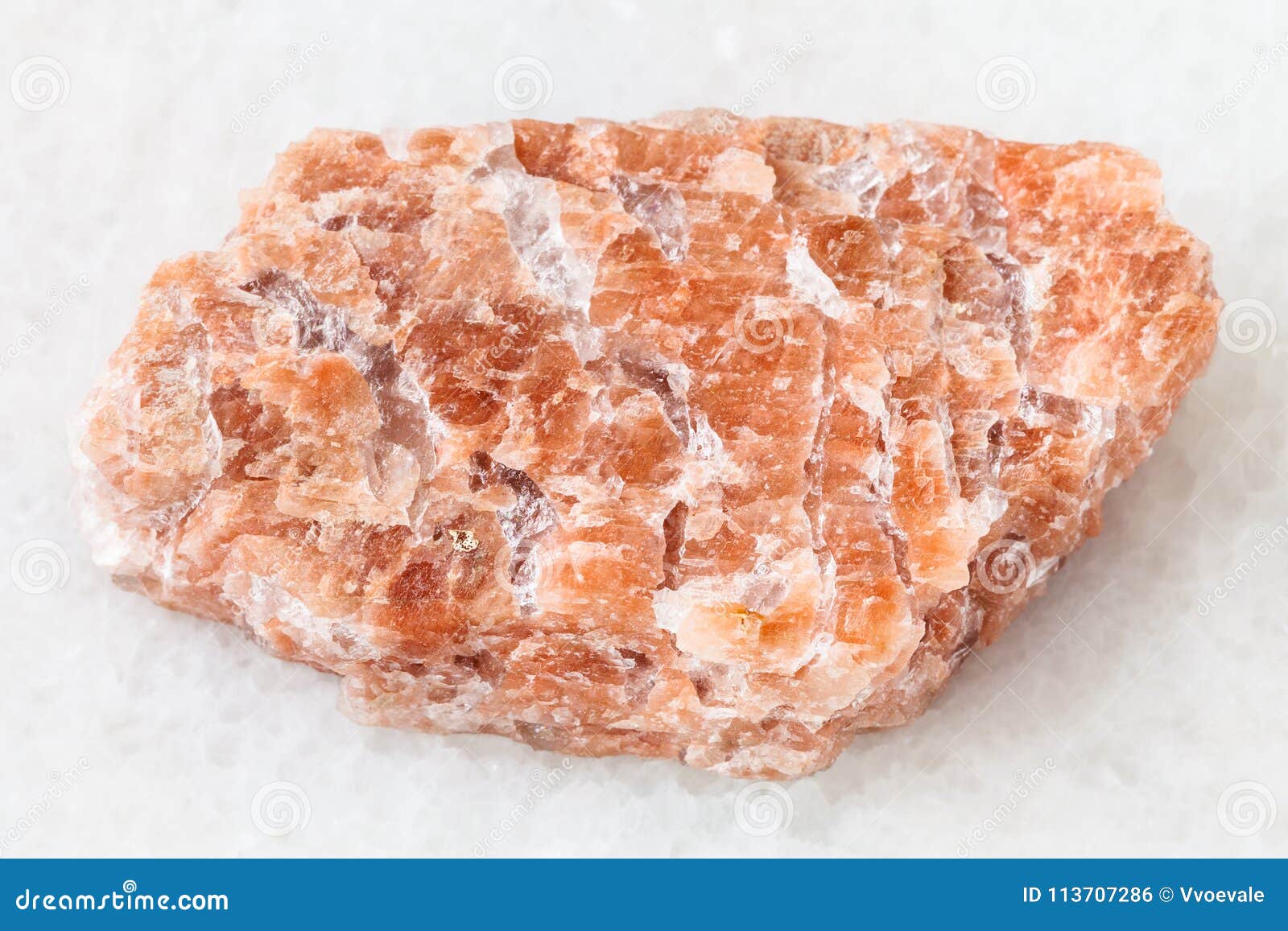 slab from rough pegmatite stone on white