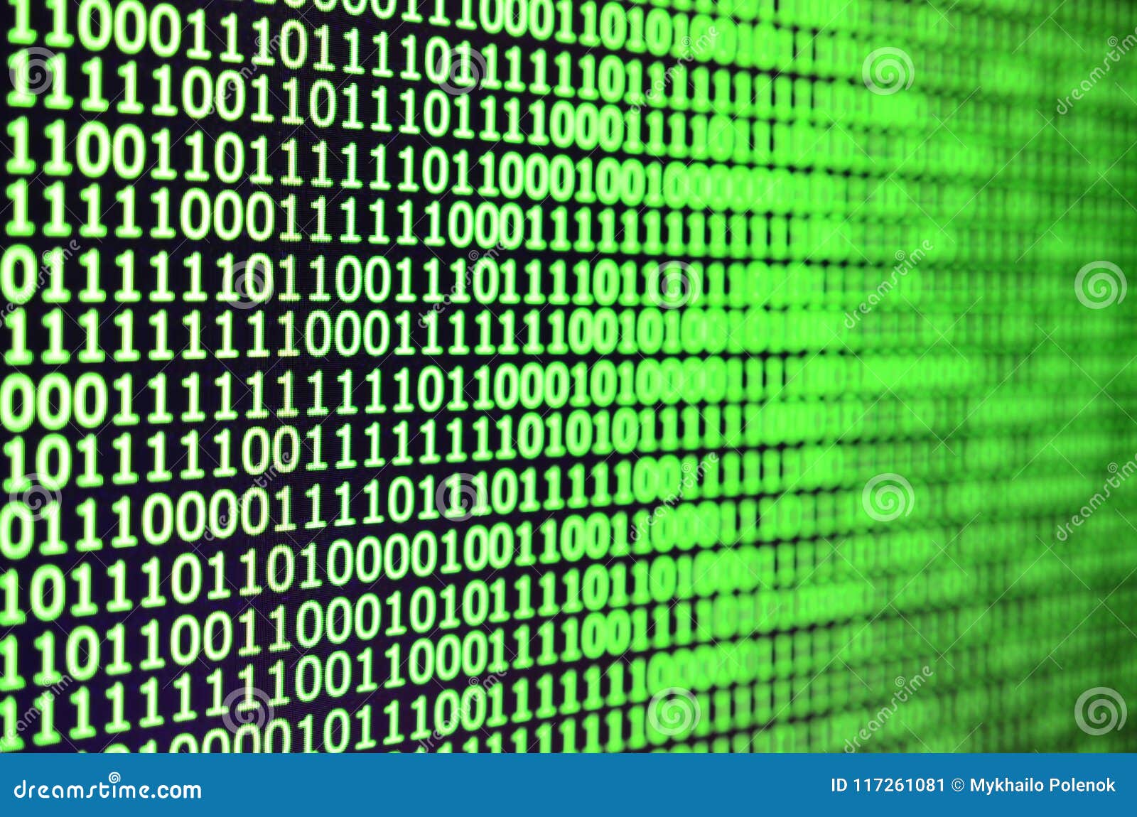 macro shot of binary code on the monitor of an office computer. the concept of the programmer`s work. the flow of digital informa