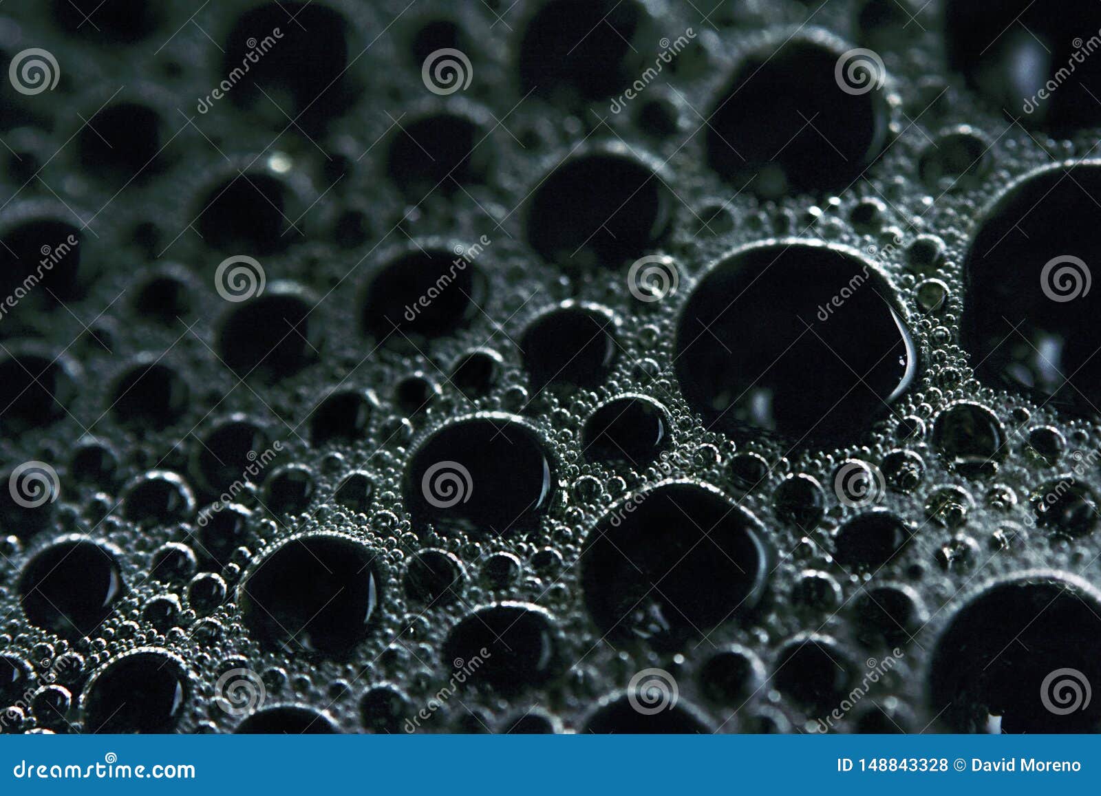 Macro Shot of the Surface Tension of Interconnected Bubbles Stock Photo