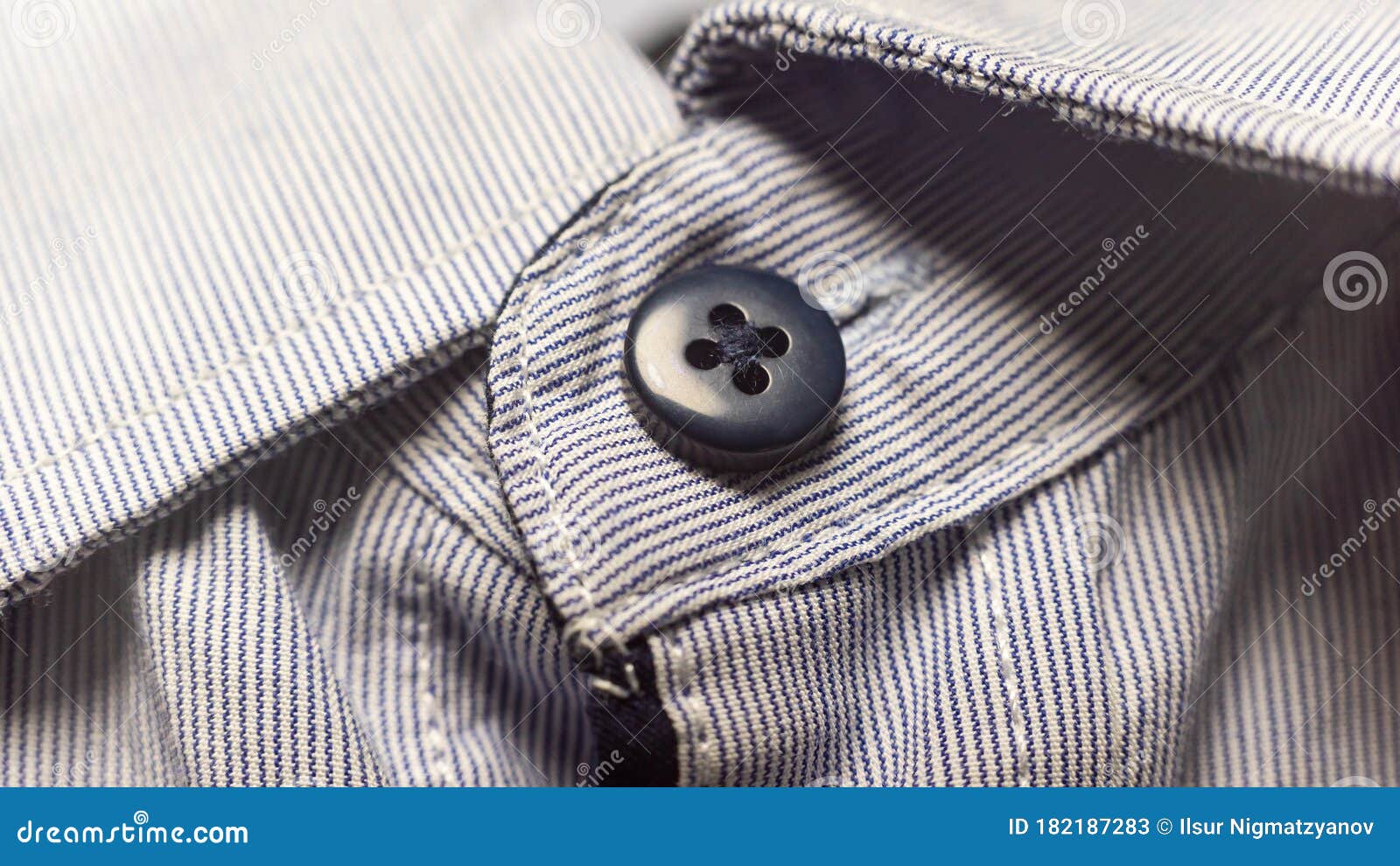 Macro Shot of the Top Black Button of a Light Shirt Made of Fabric in a ...