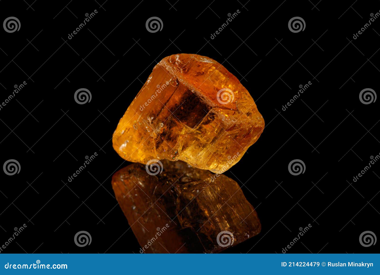 macro stone mineral yellow topaz on a black background