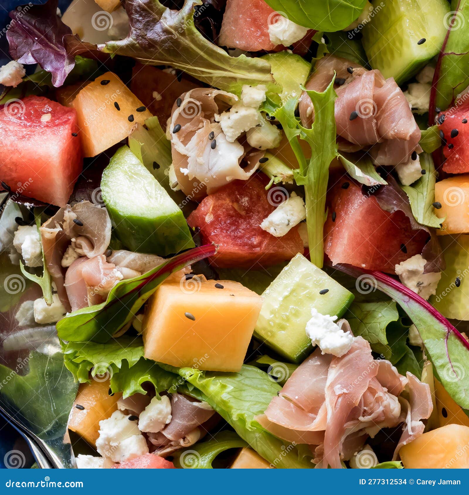 Macro View of Homemade Fresh Melon and Prosciutto Salad. Stock Photo