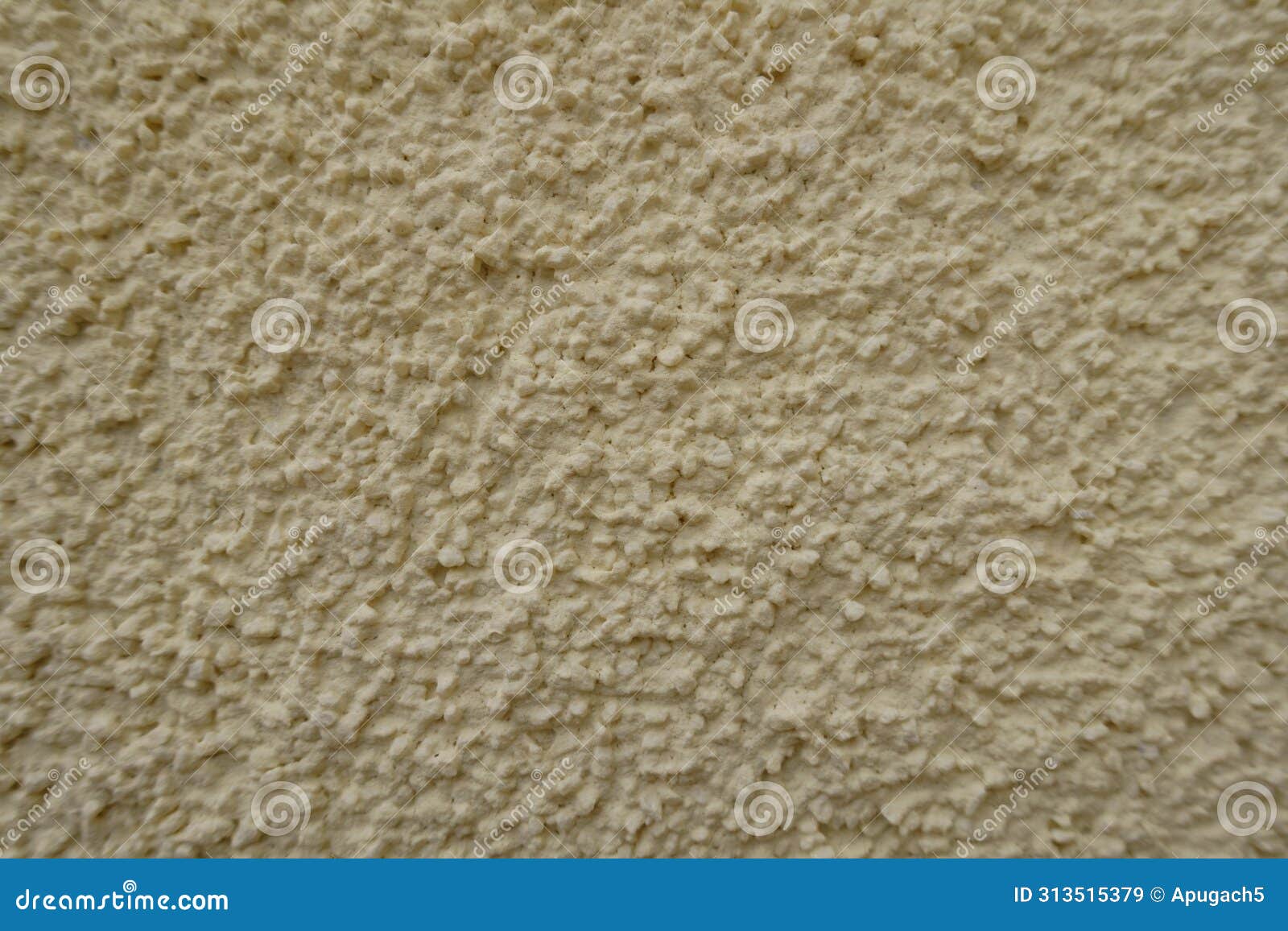 macro of wall with light beige roughcast finish