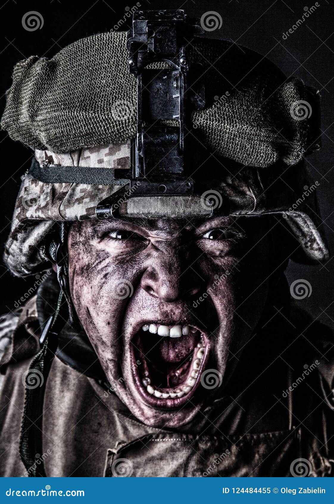 mad army soldier screaming while looking at camera