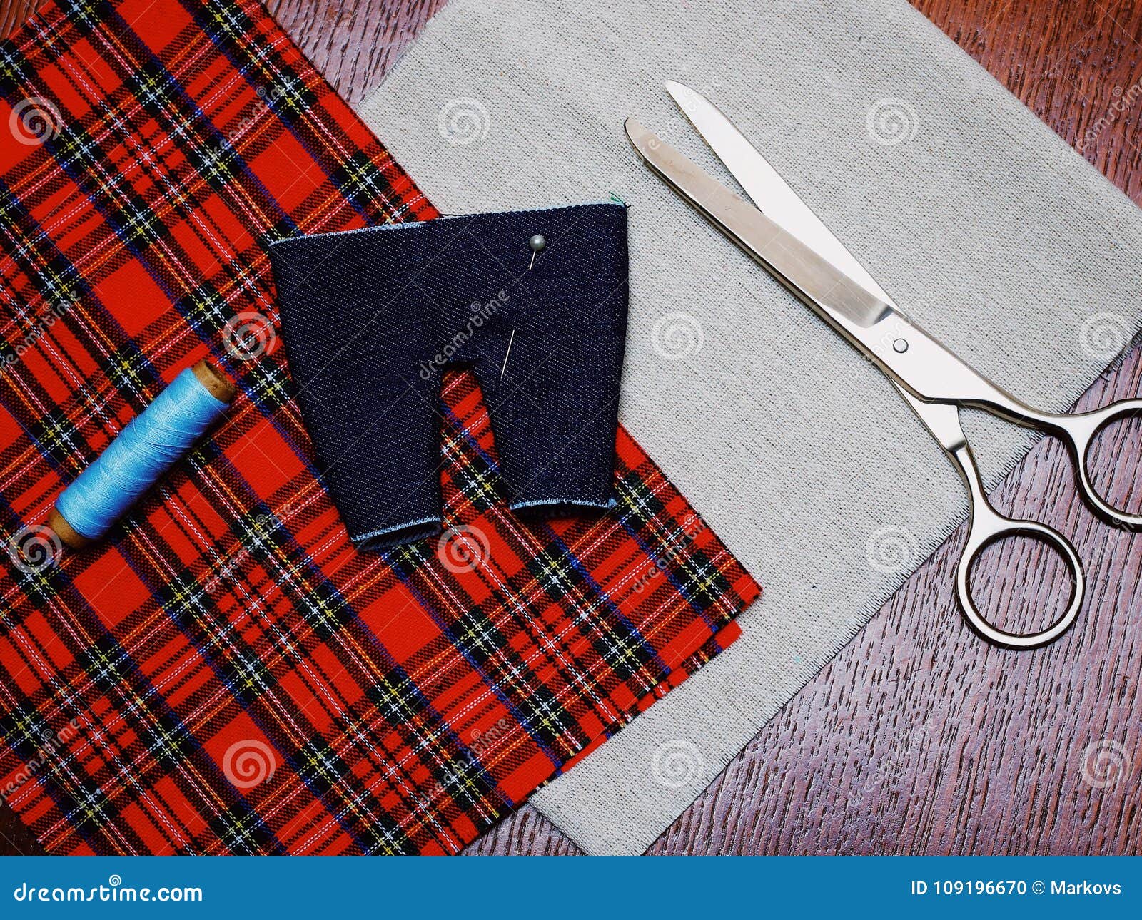 Made by Hand Sewing Small Pants for a Doll. Needlework Stock Photo