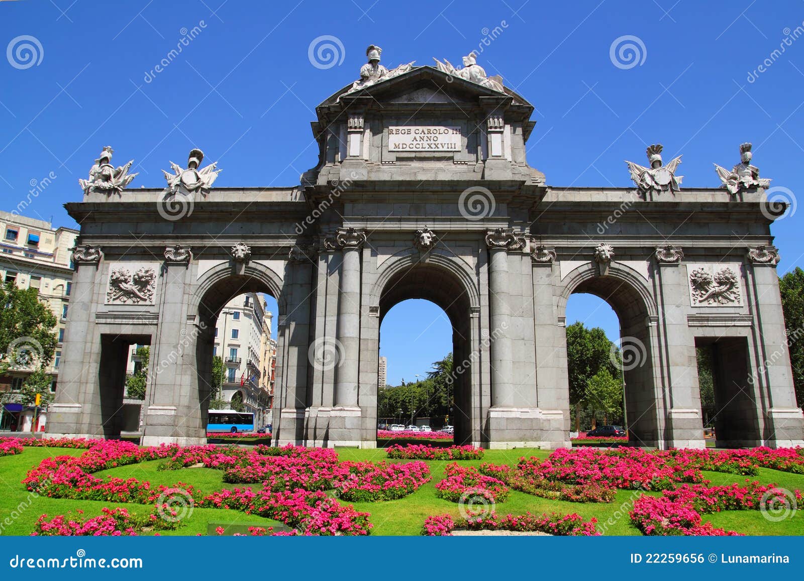 madrid puerta de alcala with flower gardens
