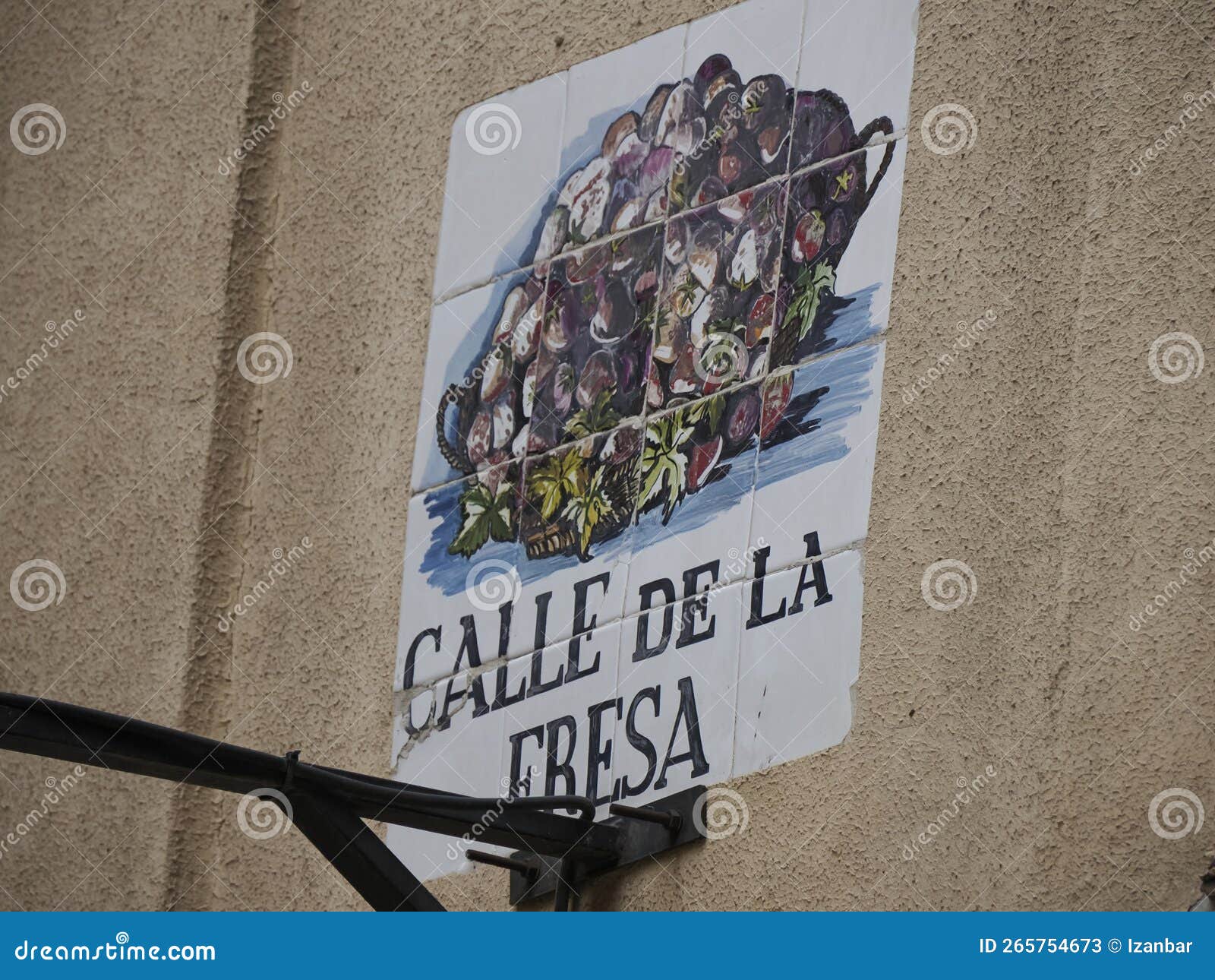 madrid, spain - december 14, 2022: street name calle de la fresa strawberry street sign on in madrid, capital of spain renowned