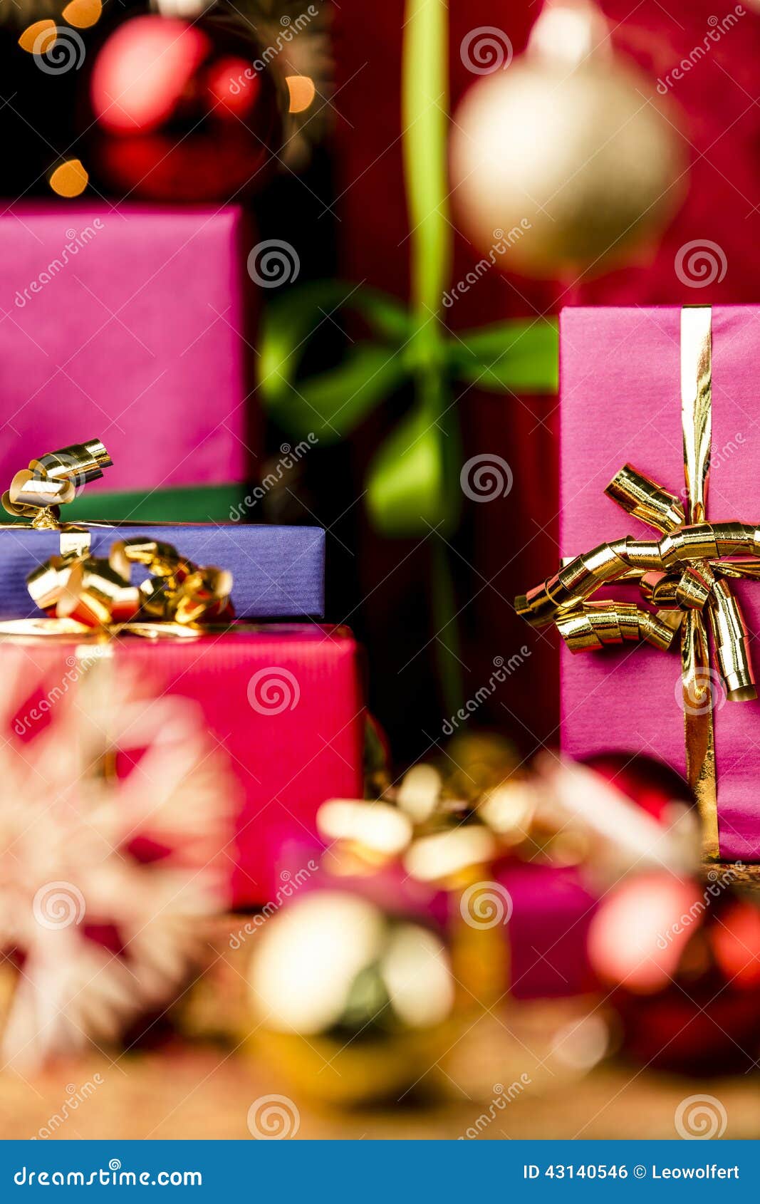 Magenta and Blue Gifts Amidst Golden Glitter Stock Photo - Image of ...