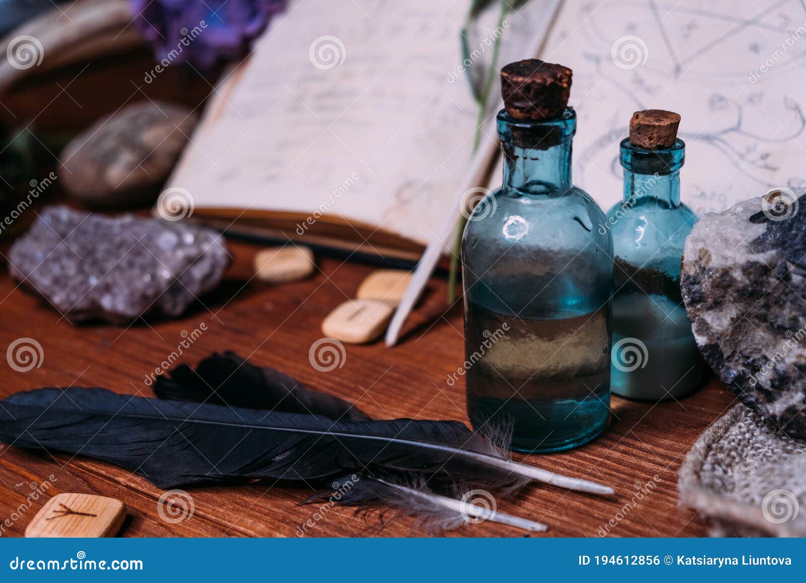 Witchcraft Concept with Potions, Herbs and Occult Equipment Stock Photo