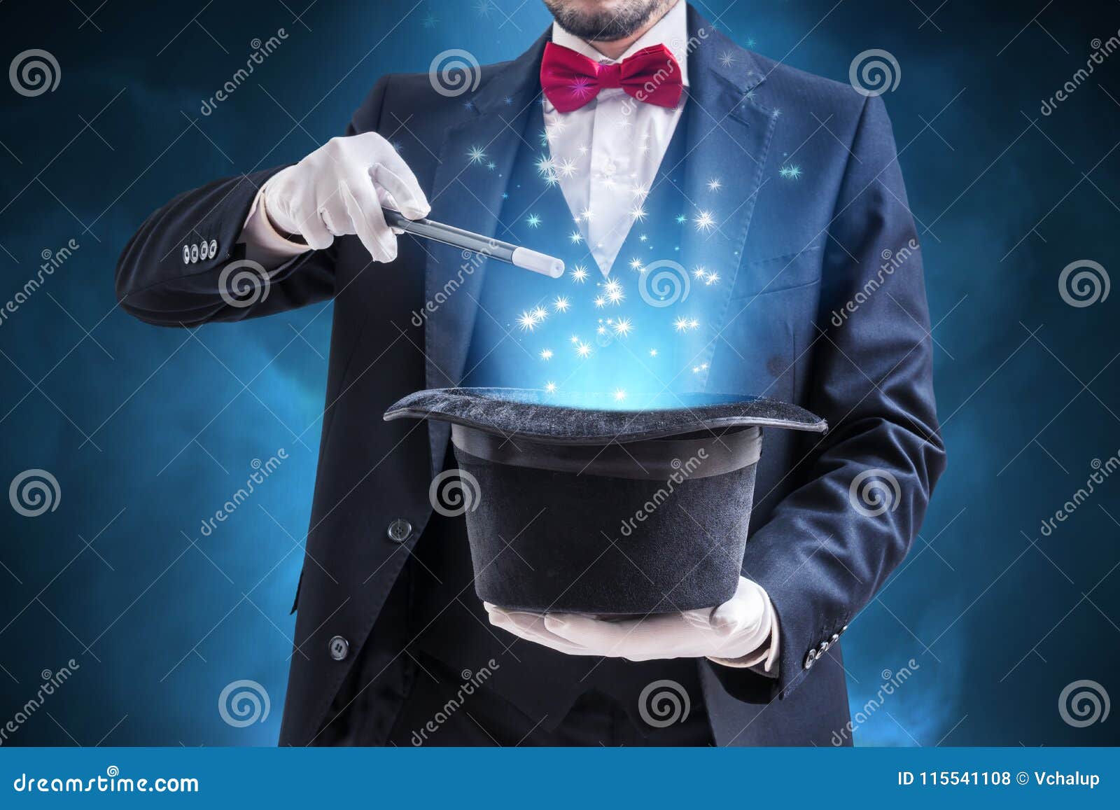magician or illusionist is showing magic trick. blue stage light in background