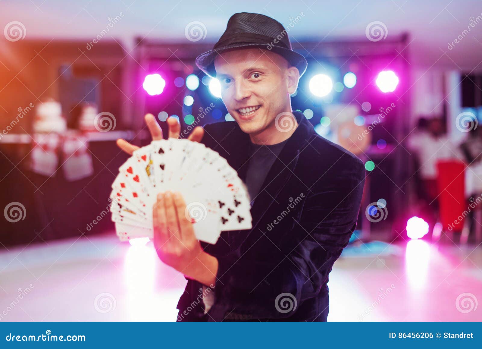 Magician Showing Trick with Playing Cards. Magic, Circus Stock Photo