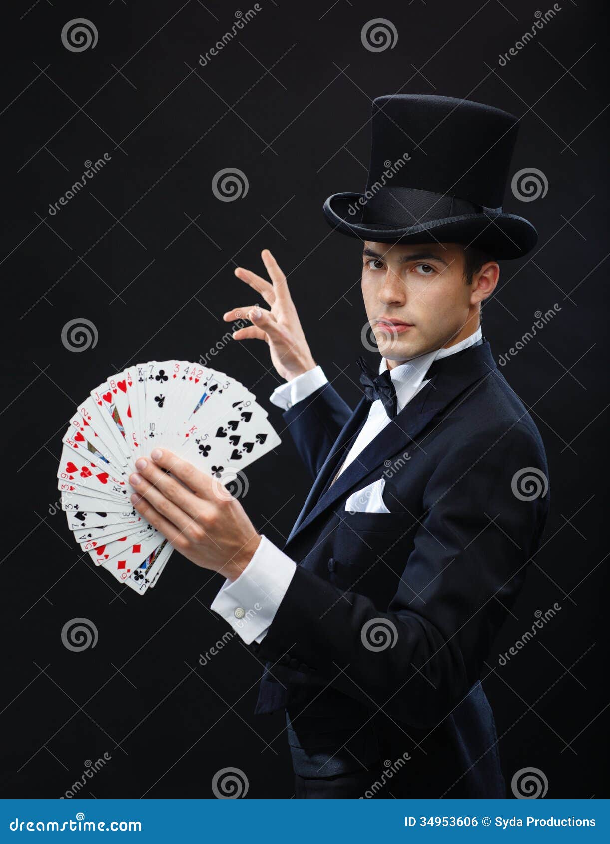 Magician Showing Trick With Playing Cards Royalty Free Stock Image - Image: 34953606