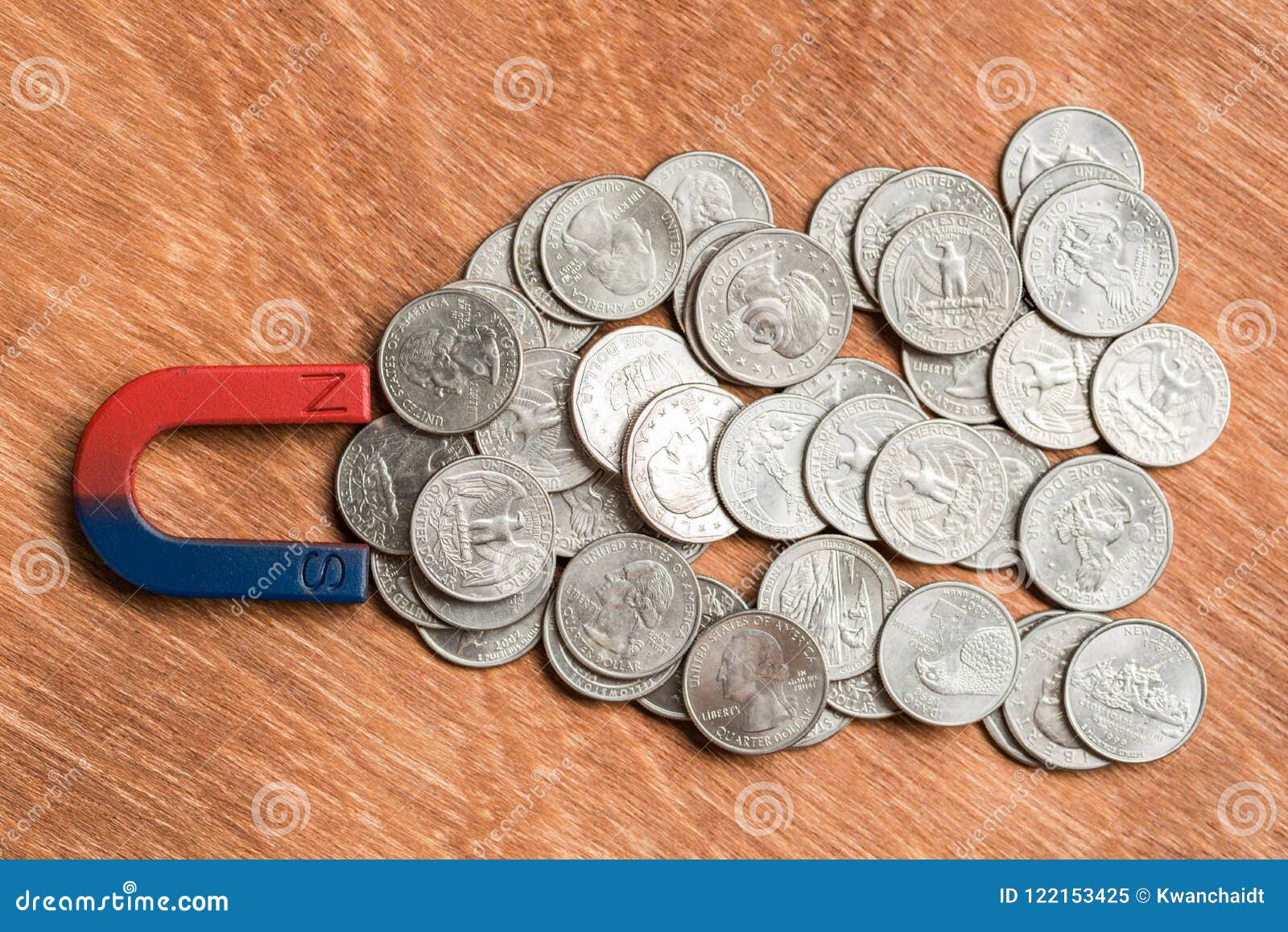 Magnetic pull the coins stock image. Image concept - 122153425