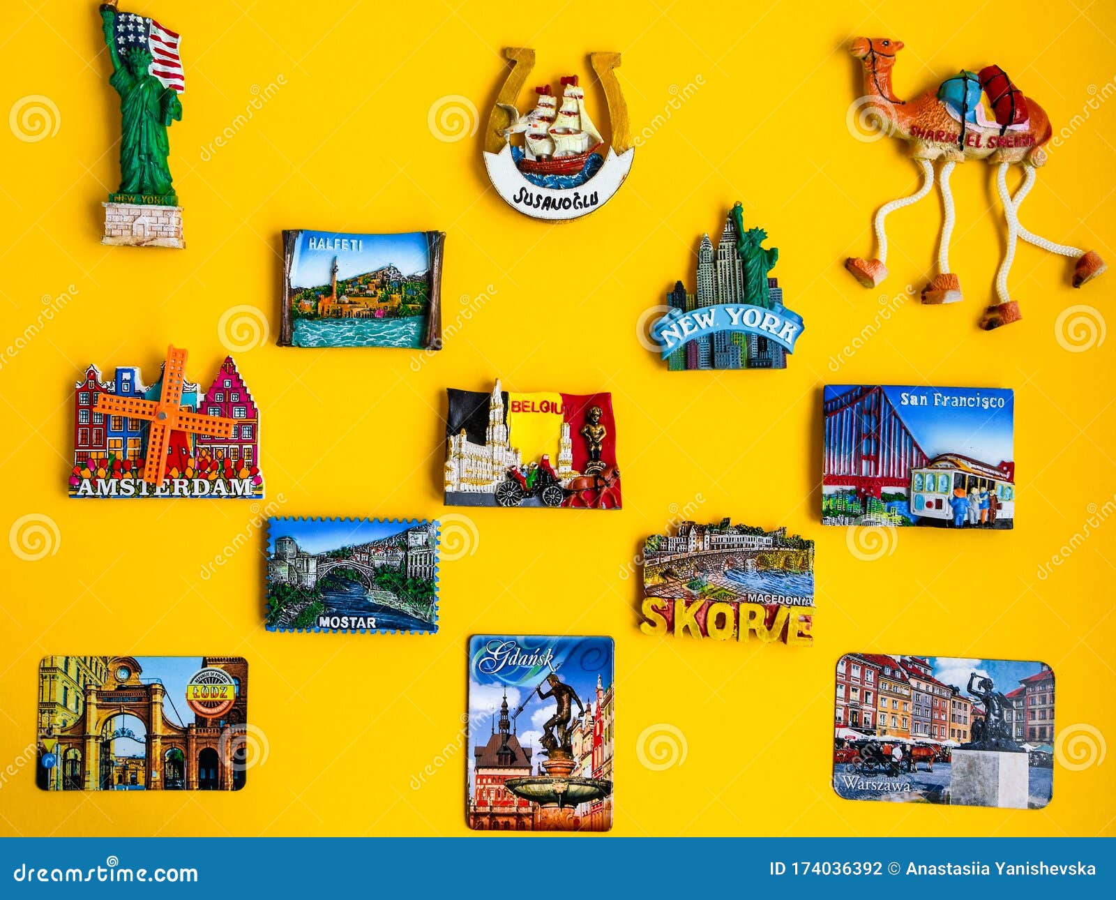 Magnets from Different Countries on Yellow Background, Travel Concept