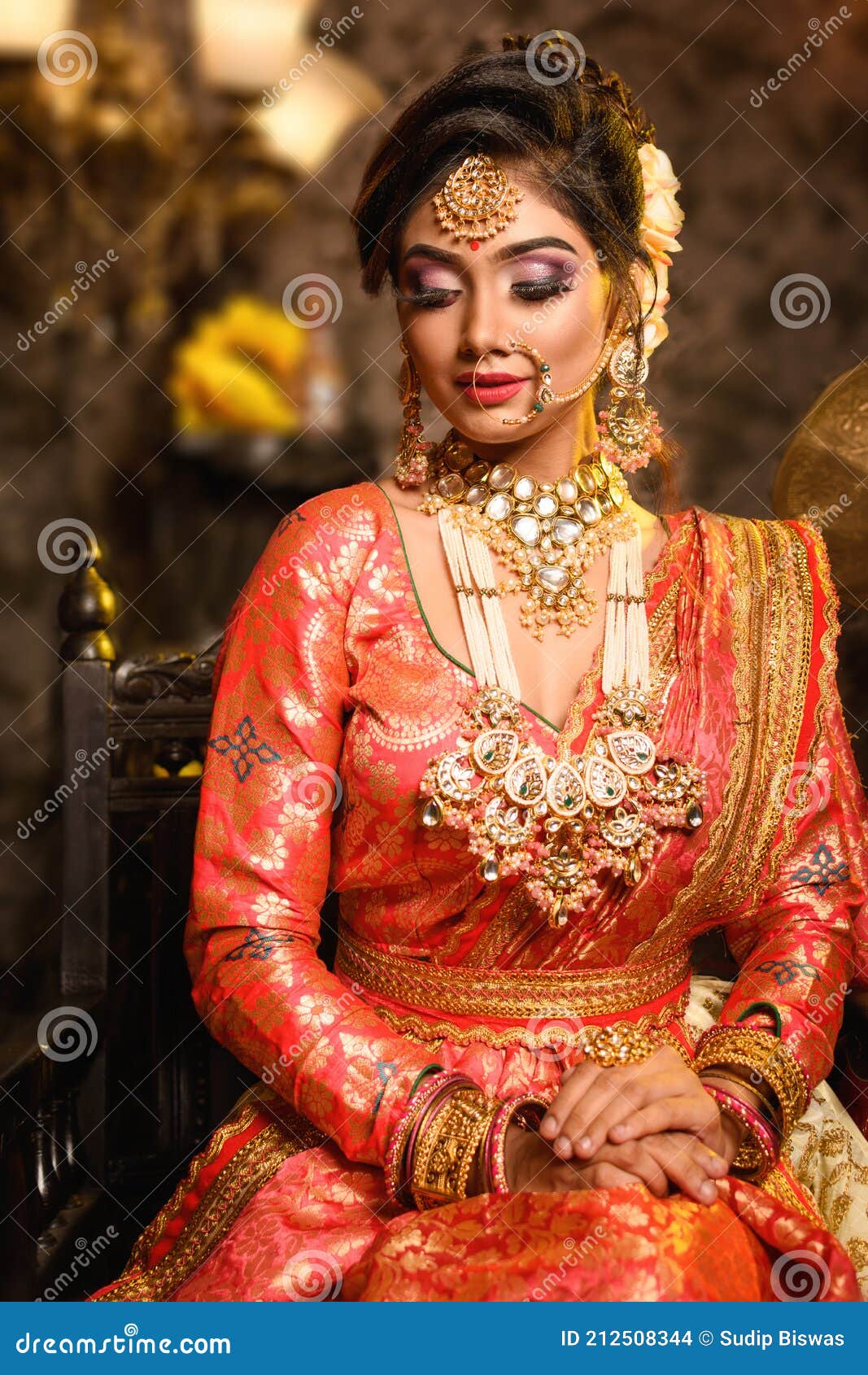 Magnificent Young Indian Bride in Luxurious Bridal Costume with Makeup and  Heavy Jewellery is Sitting in a Chair Stock Photo - Image of indian, hair:  212508344