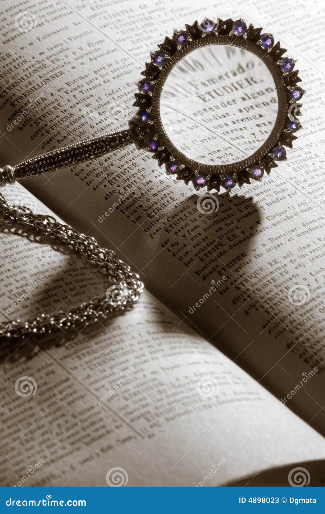 Magnifier on dictionary stock image. Image of culture 4898023