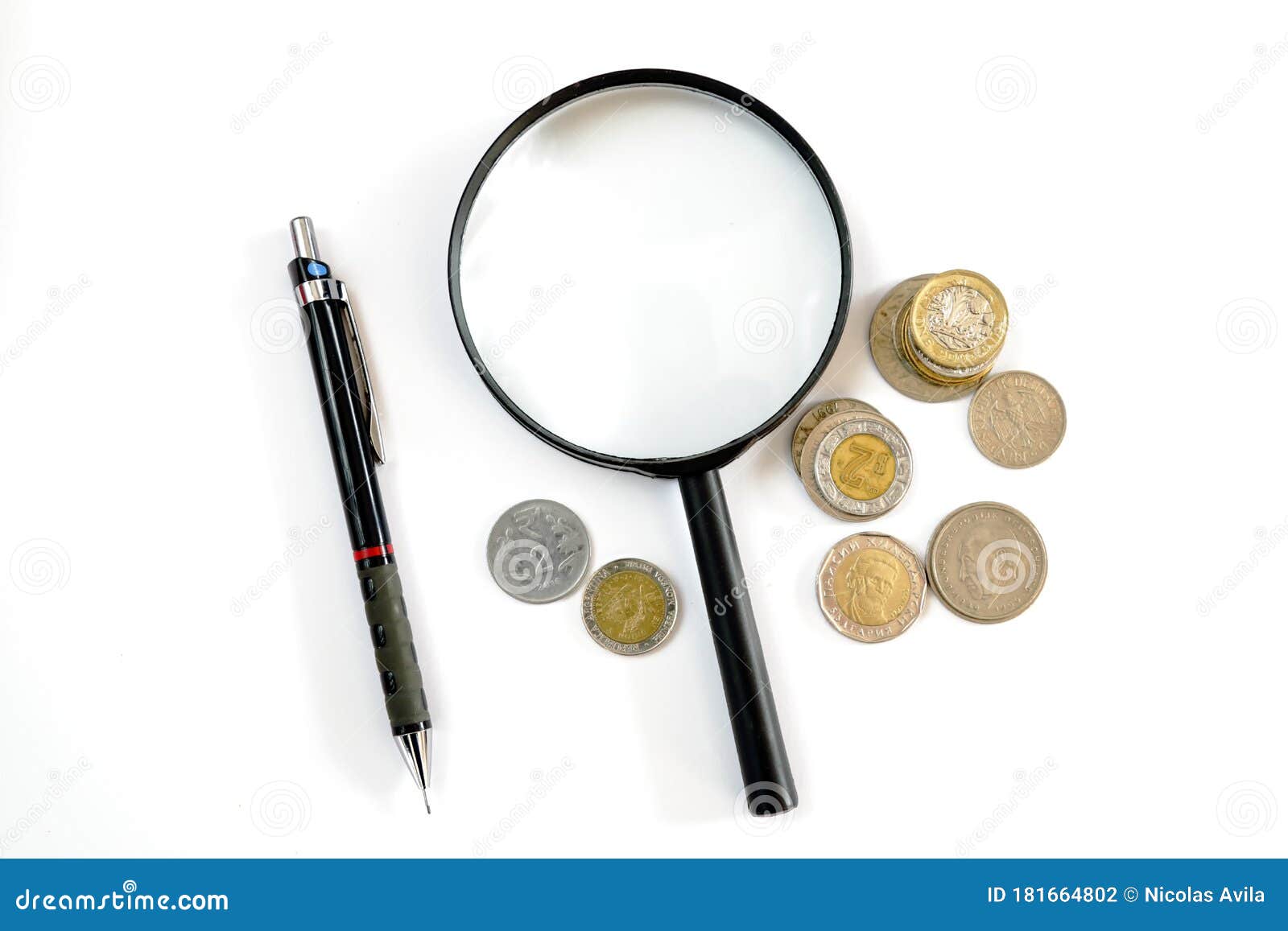 magnifying glass, coins of various countries