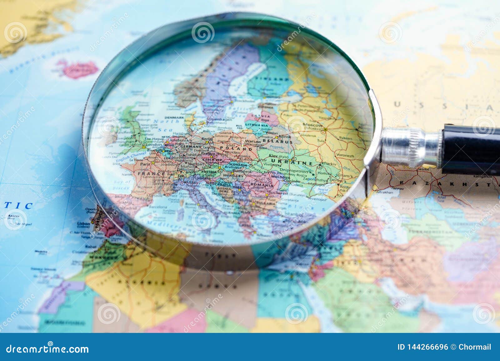 magnifying glass on europe world globe map