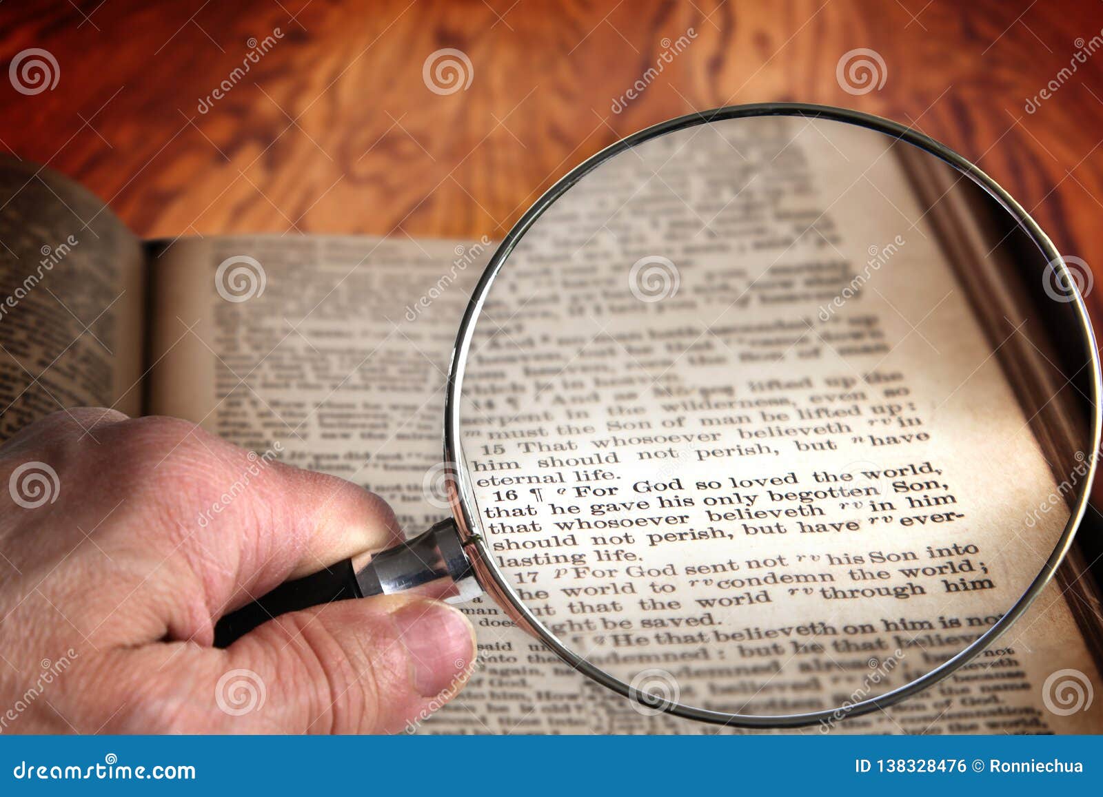 magnifying glass on famous bible verse john 3:16