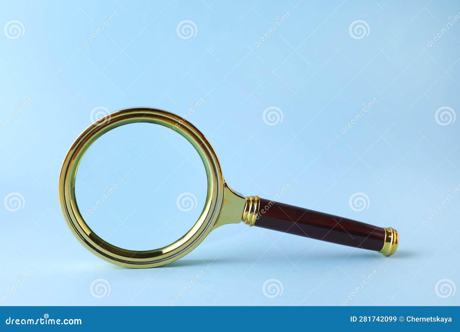 Magnifying Glass with Handle on Light Blue Background Stock Image