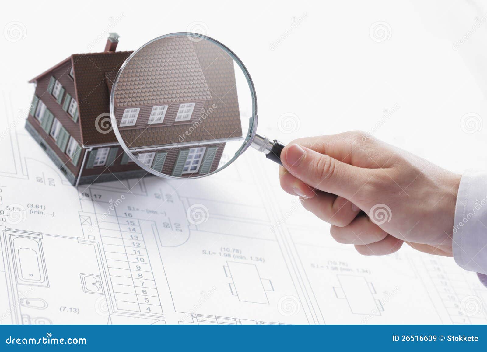 magnifying glass and house.