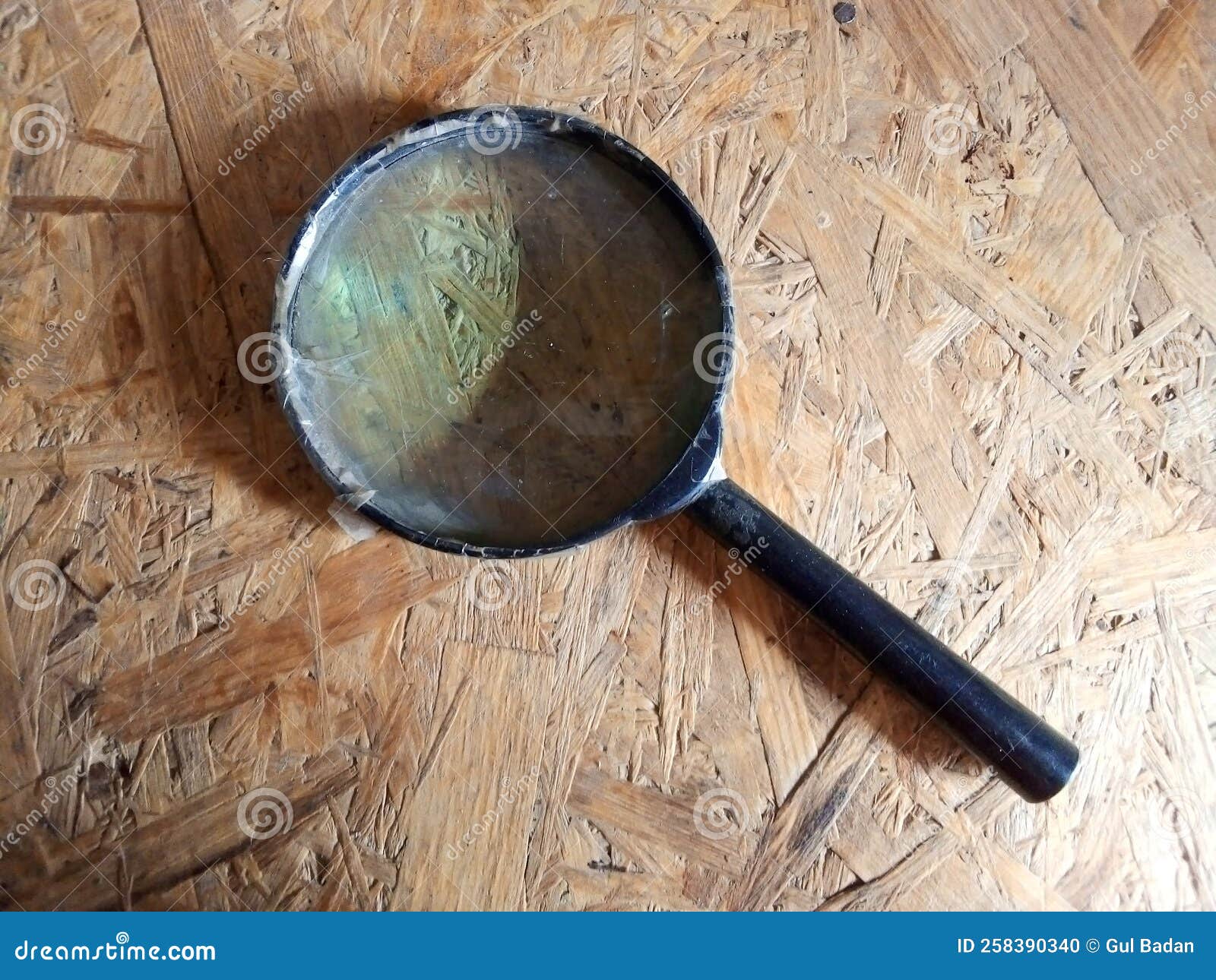 Magnifying Glass on Wood Surface Stock Photo - Image of brown