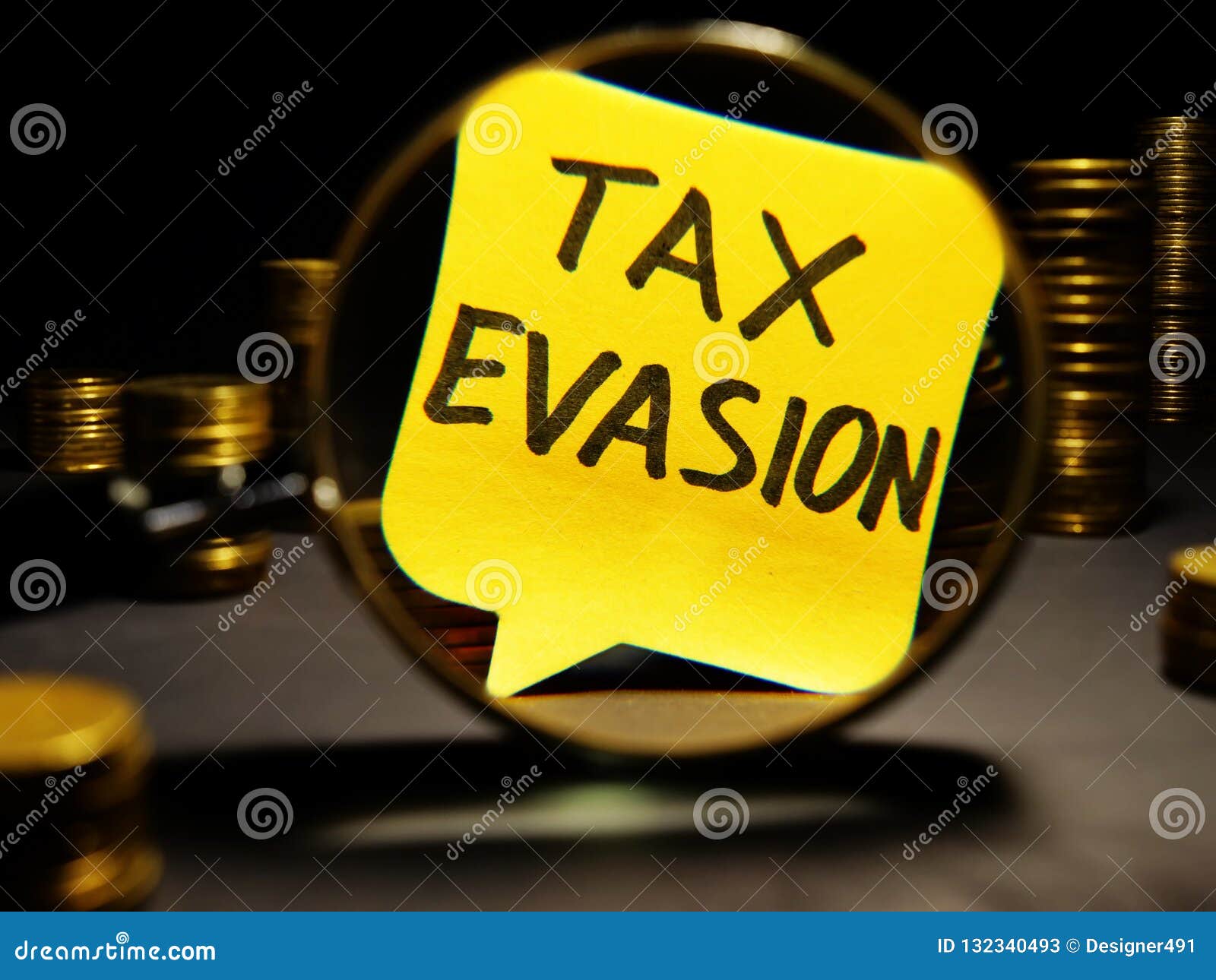 magnifying glass and words tax evasion with money