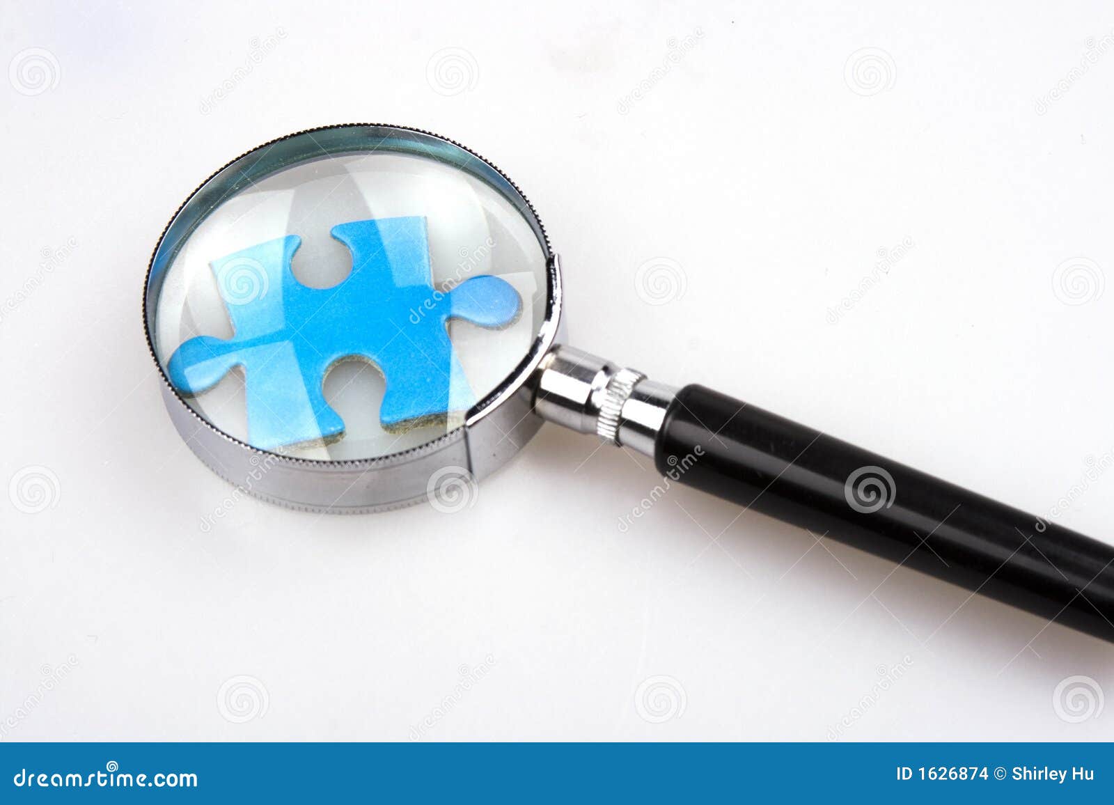 Magnifying Jigsaw Puzzle stock photo. Image of jigsaw 1626874