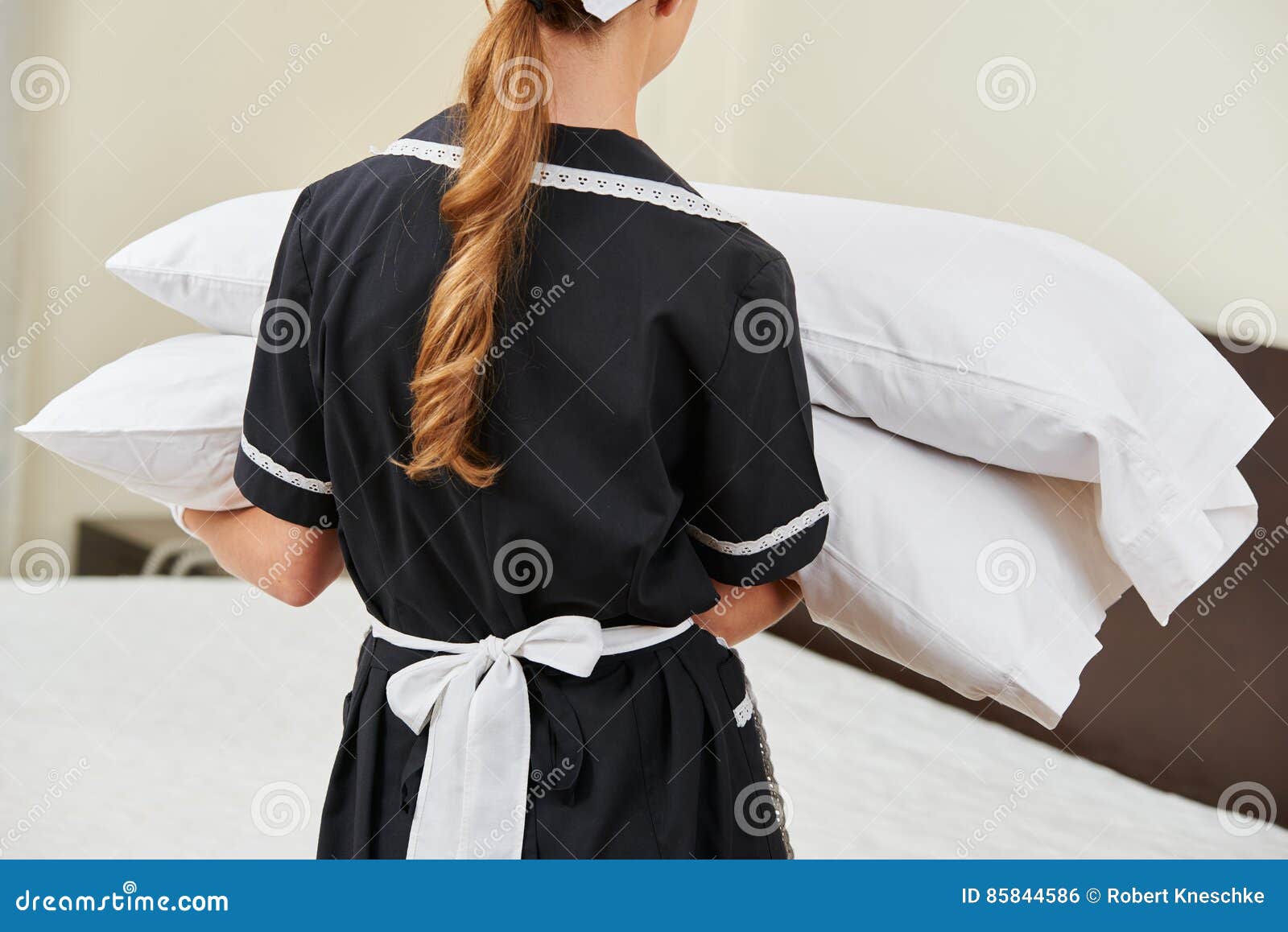 Maid Changing Pillows during Housekeeping Stock Photo Image of