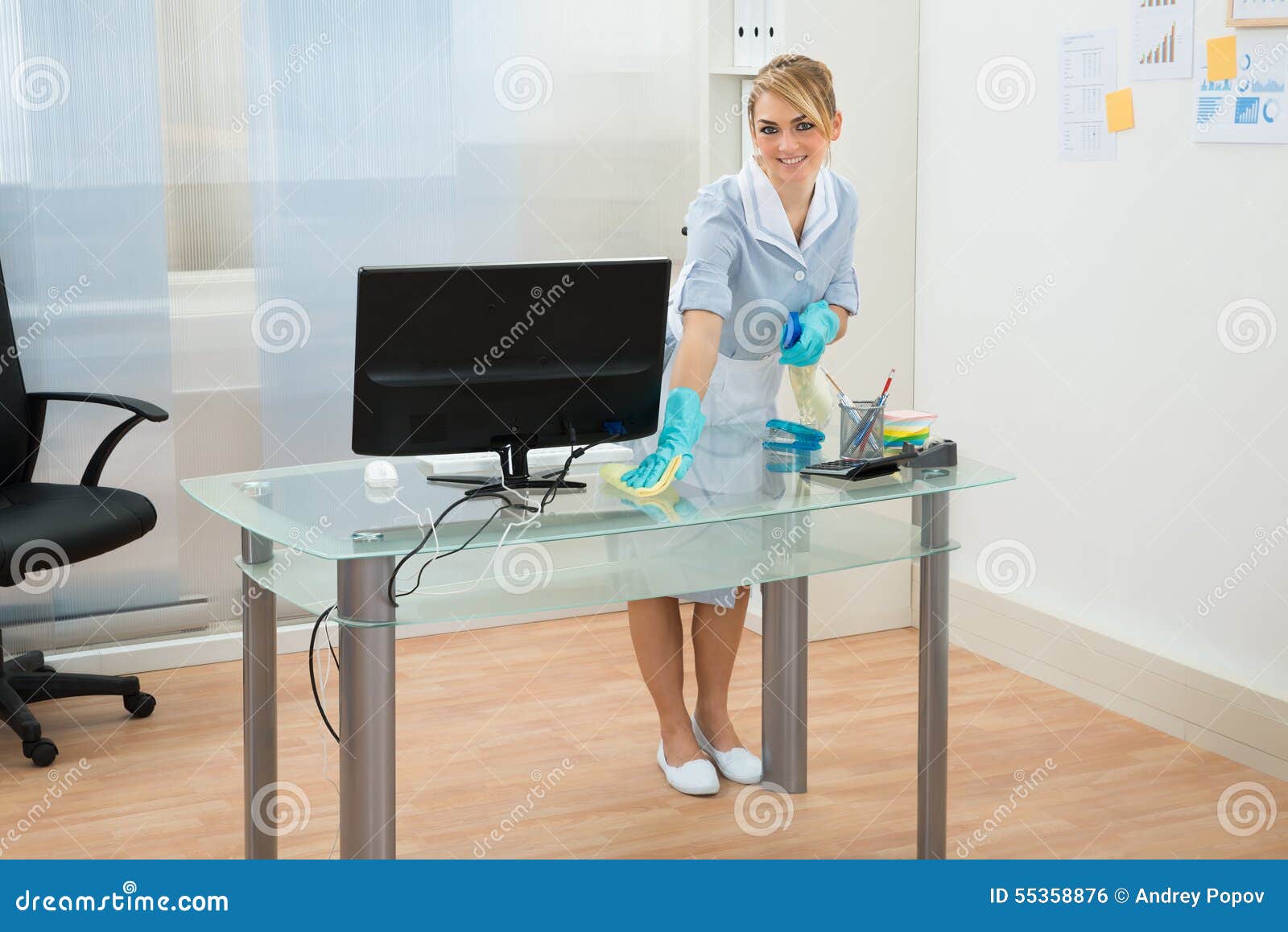 Maid Cleaning Desk in Office Stock Photo - Image of housekeeping,  housekeeper: 55358876