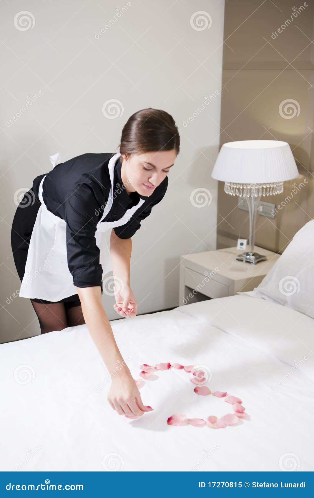 Maid Preparing Bed for Honeymooners Stock Image Image of women