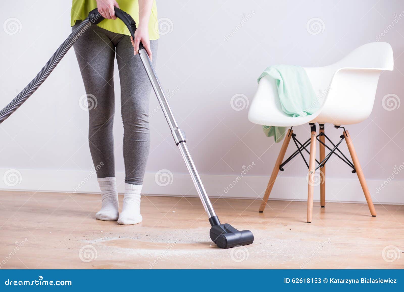 Maid vacuuming floor stock image. Image of detergents 62618153