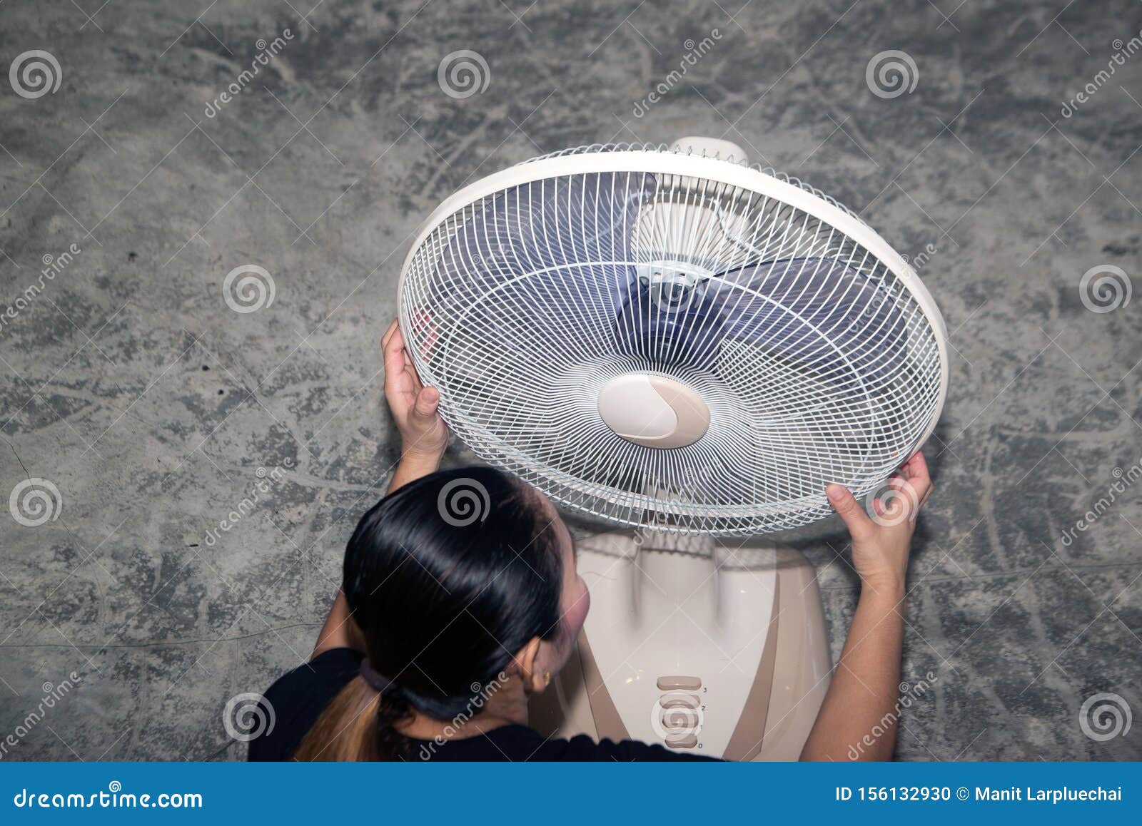 The Maidservant is Assembling and Installing an Electric Fan after