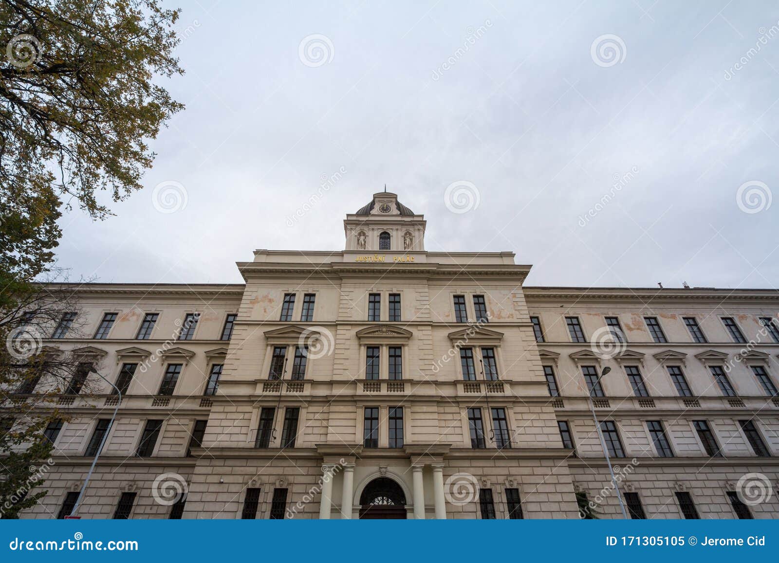 main facade of the historical building of the justice court justicni palac of prague, czech republic.