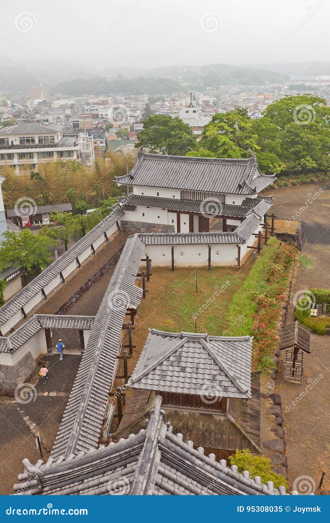 main gate and walls of shiroishi castle, japan