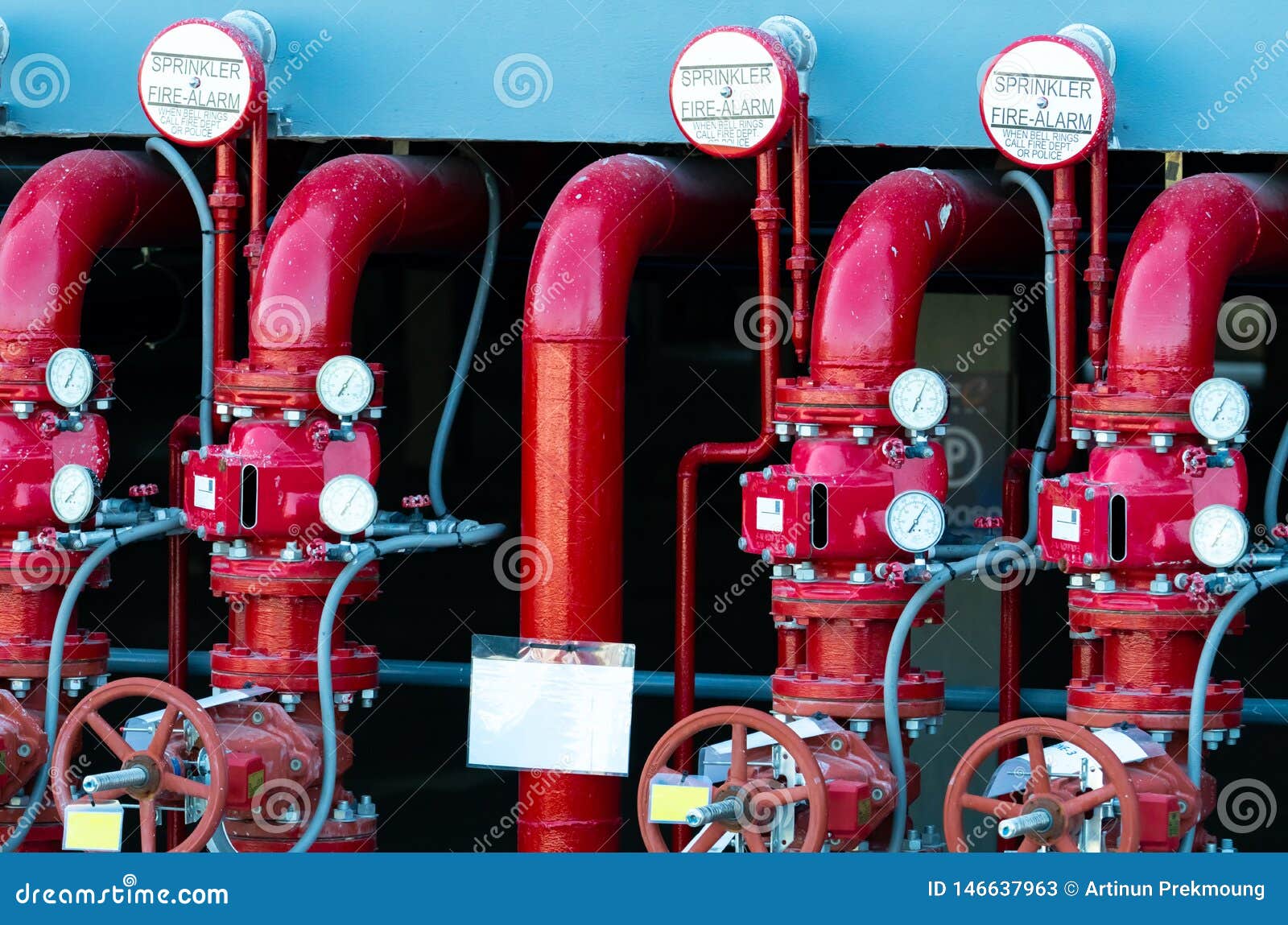main supply water piping in the fire extinguishing system. fire sprinkler system with red pipes. fire suppression. manual valve