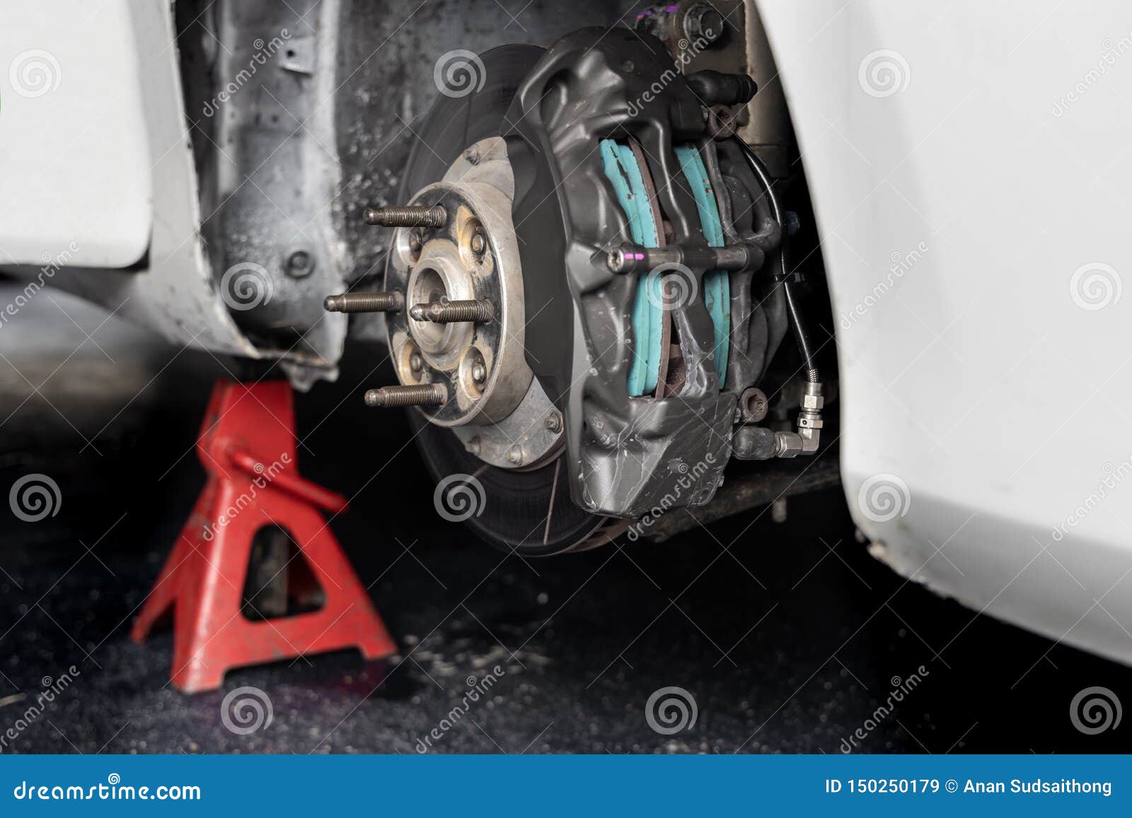 Maintenance Car. Jacking Up a Car for Changing Tire in Garage Stock Image Image of hydraulic