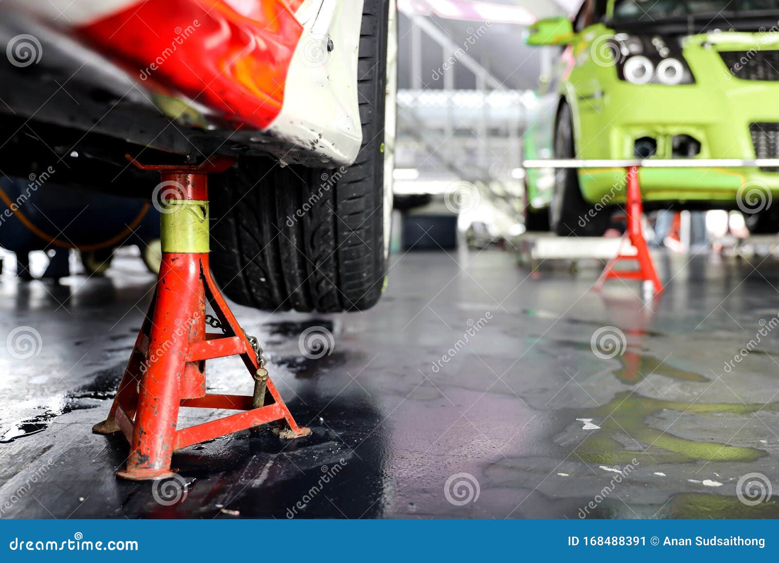 Maintenance Car. Jacking Up a Car for Changing Tire in Garage Stock Image Image of auto
