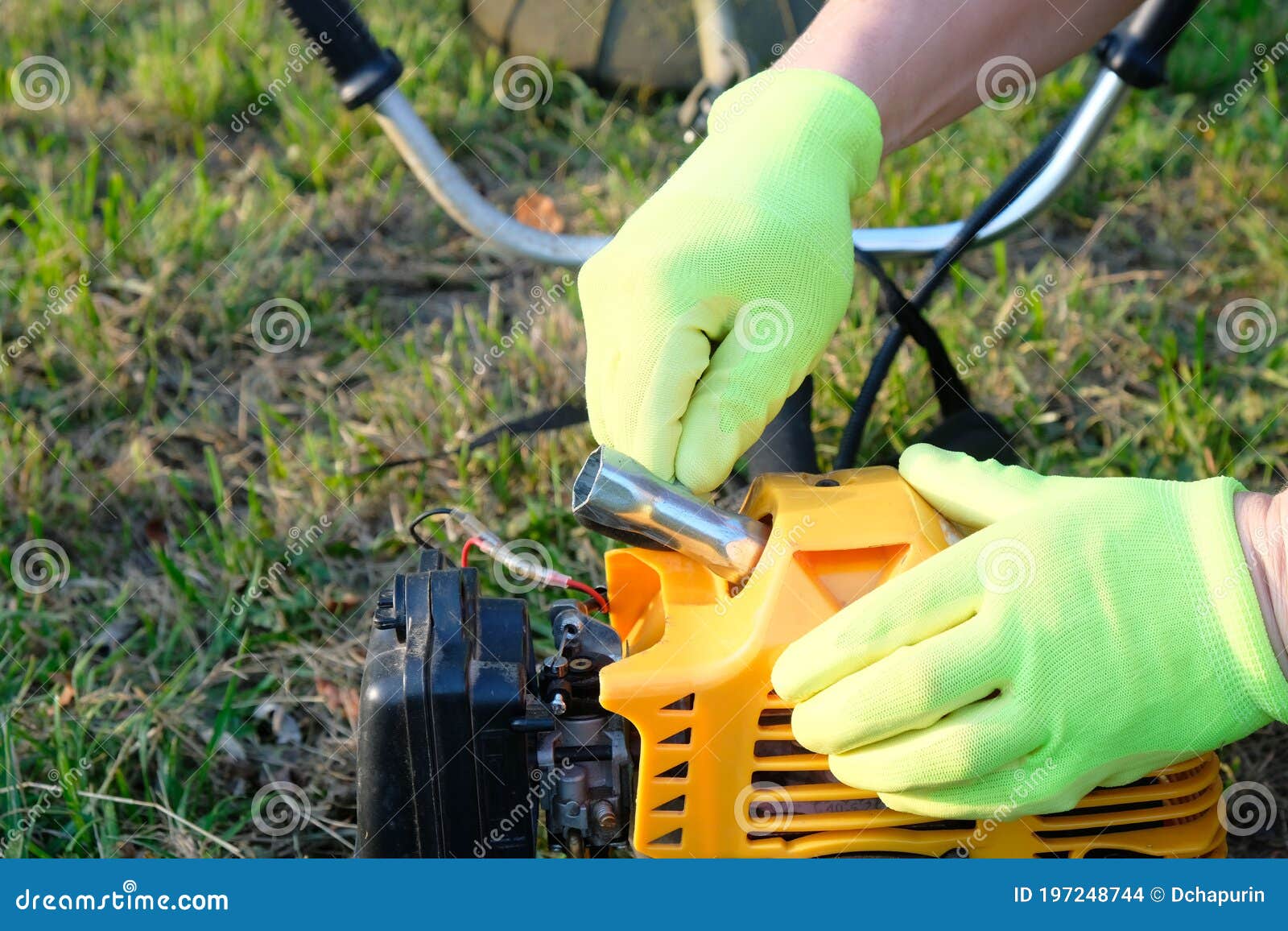 Maintenance Grass Trimmer, Process of Unscrewing Spark Plug Stock Photo