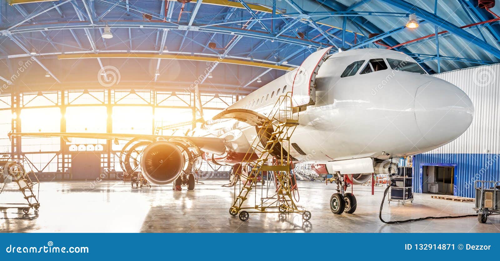 maintenance and repair of aircraft in the aviation hangar of the airport, view of a wide panorama