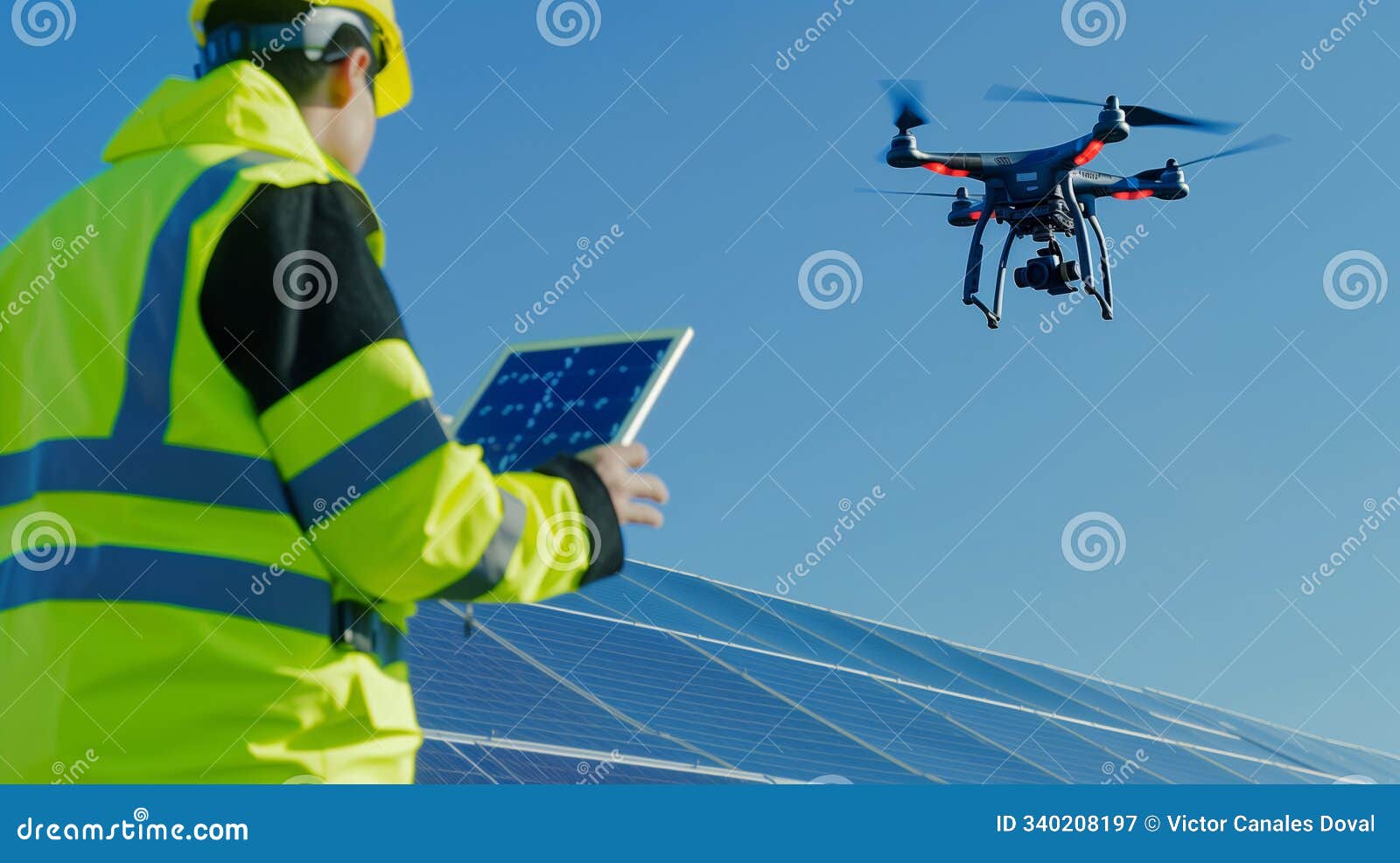 maintenance technician inspecting solar pannel installation with a drone