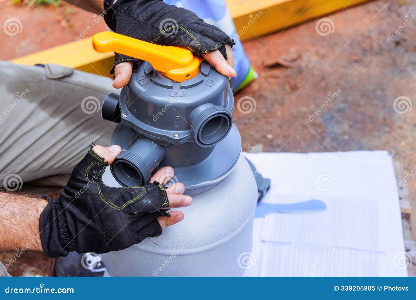 Maintenance Worker Assembles Sand Filter System Tank, a Equipment Used