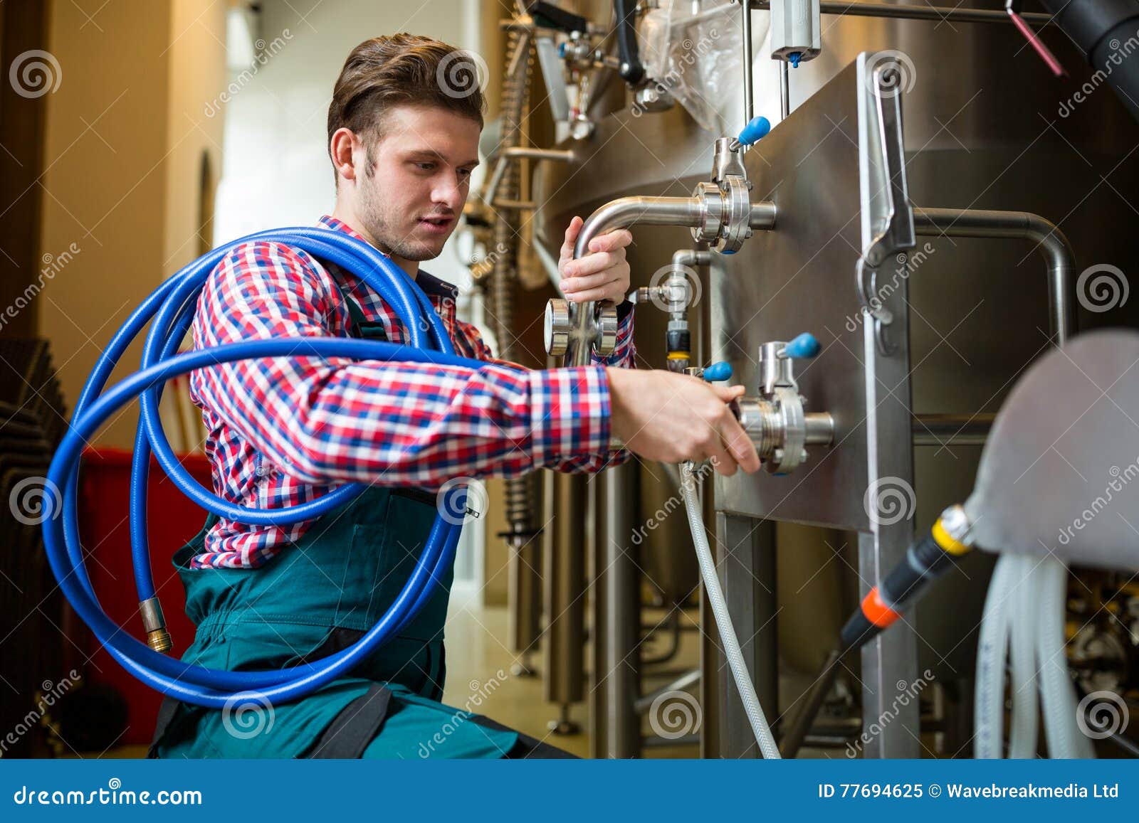 Maintenance Workers Examining Brewery Machine Stock Image Image of