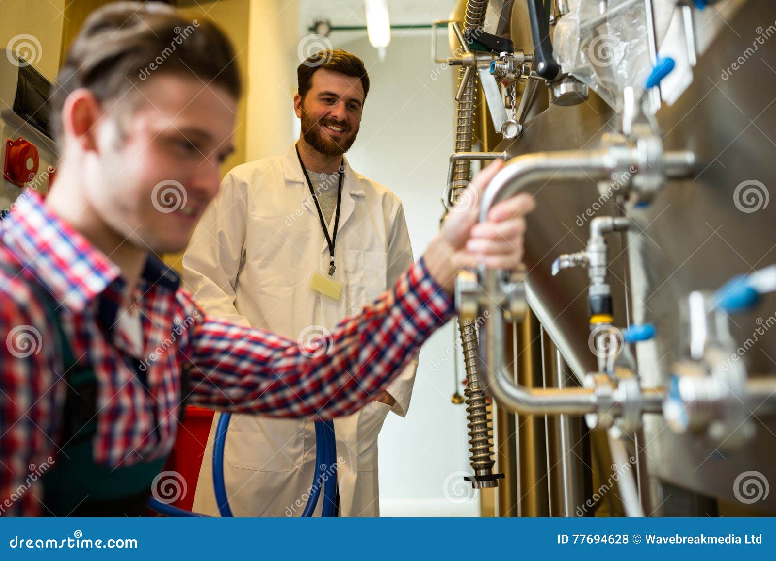 Maintenance Workers Examining Brewery Machine Stock Photo Image of