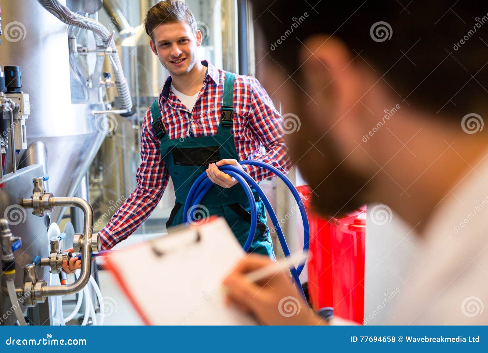 Maintenance Workers Examining Brewery Machine Stock Photo Image of