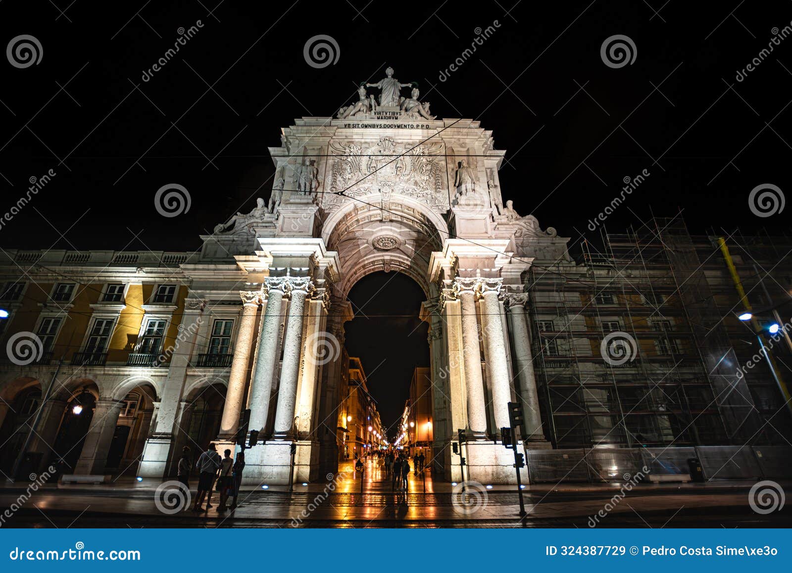 the majestic arco da rua augusta seen from praÃ§a do comÃ©rcio at night - lisbon, portugal