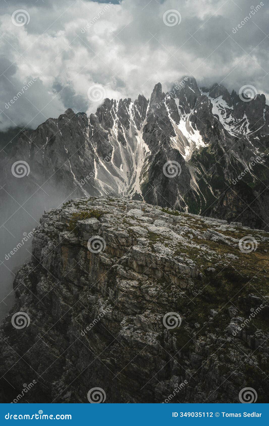 a majestic mountain blanketed in pure white snow under a cloudy sky
